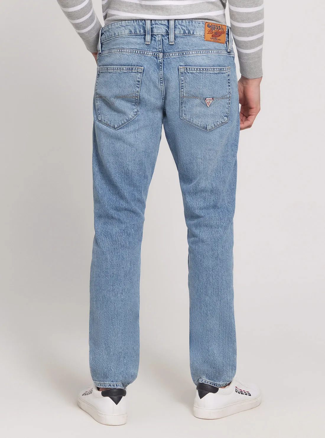 Low Rise Slim Tapered Denim Jeans in Light Wash