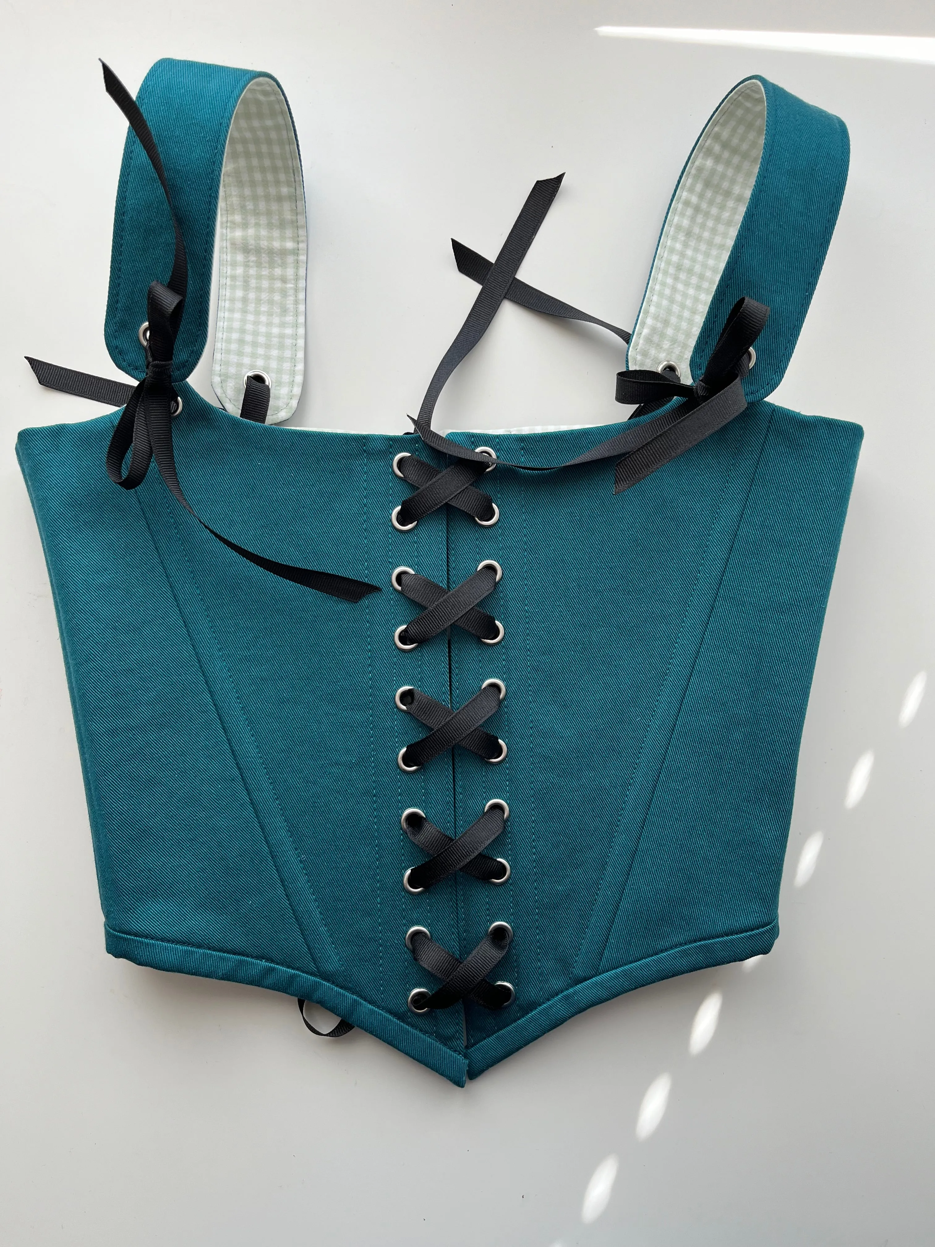 Teal corset with front and back ties, removable shoulder straps,